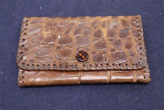 A 9ct gold mounted crocodile skin clutch bag, retailer Davis of Picadilly